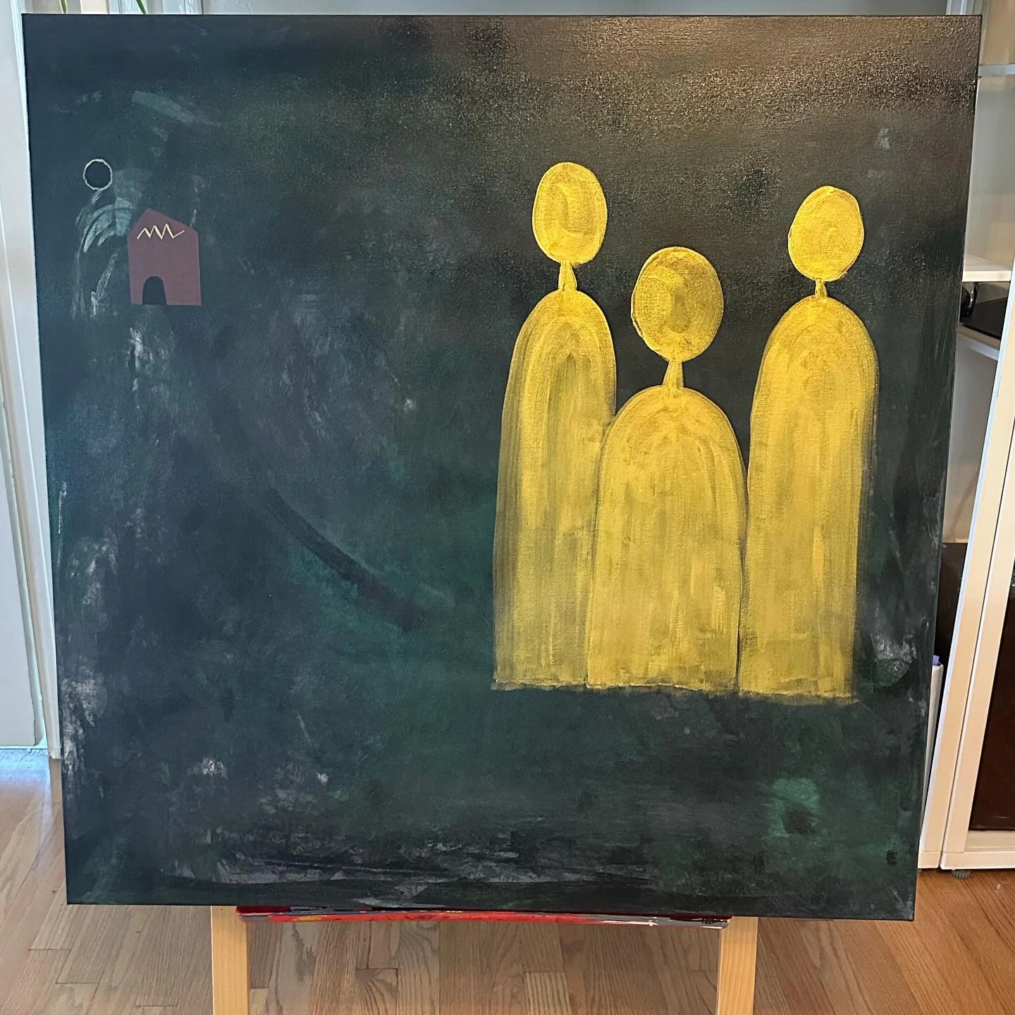 No. 90. Three golden figures grouped on the right of a dark green textured canvas.
