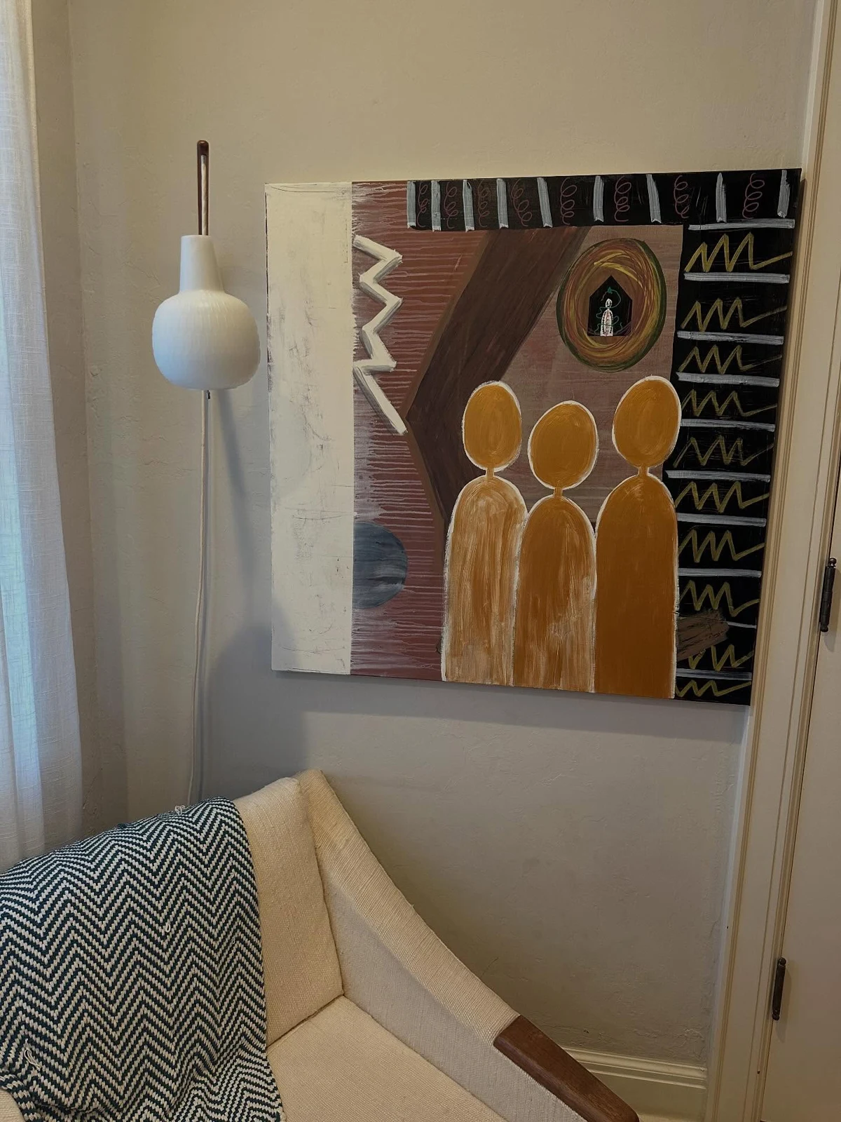 No. 97. Three golden figures beneath a small oval eye, with geometric marks on a brown and black background.