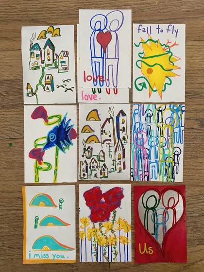 Postcards — Series 1. Nine hand-painted postcards arranged in a grid, featuring houses, figures, hearts, birds, and short handwritten messages.