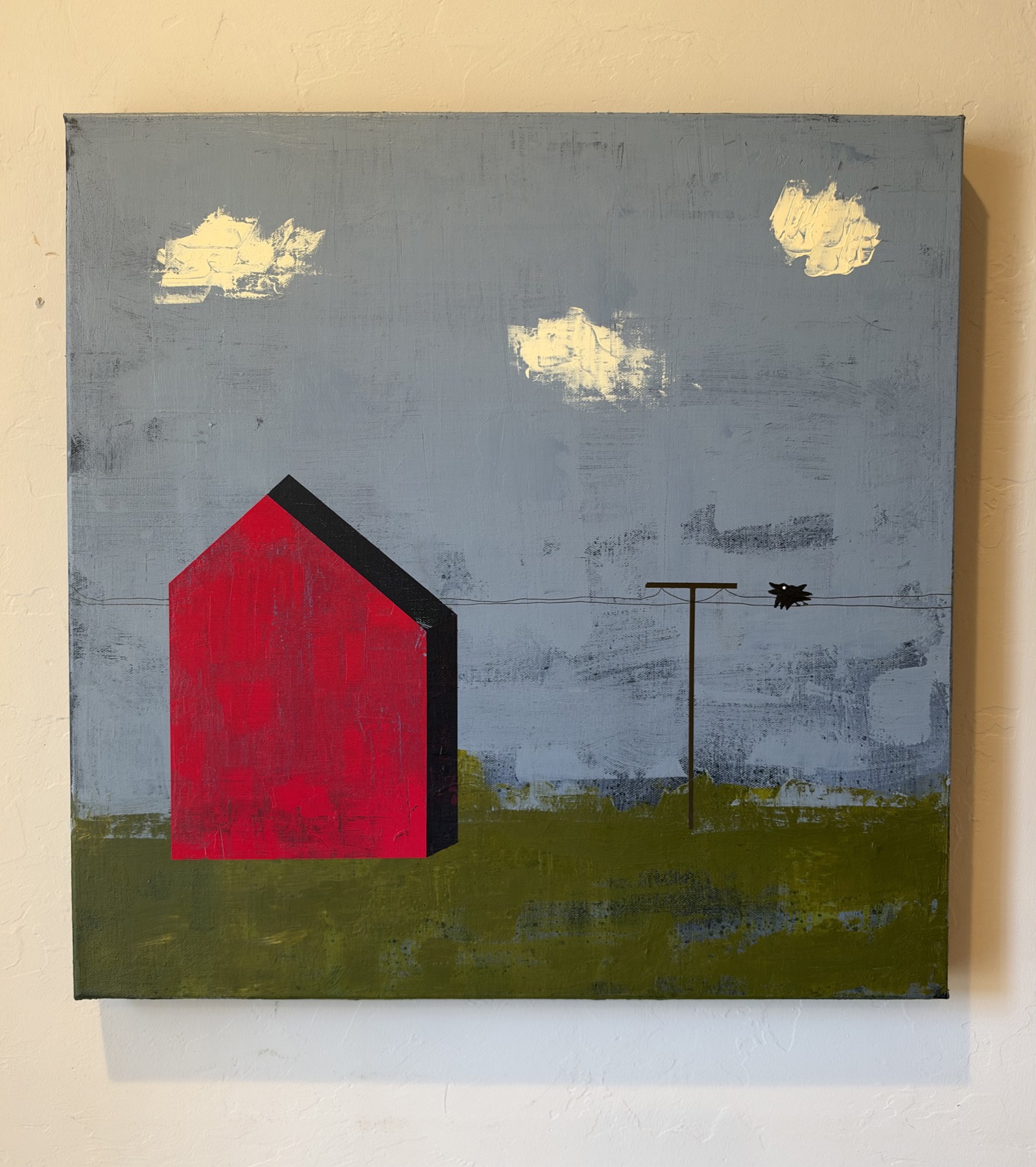 For the Time Being. A red barn and a utility pole with a solitary black crow beneath three pale clouds, against a textured blue-gray sky and green ground.
